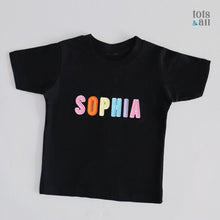 Load image into Gallery viewer, Personalised Black Kids T-shirt in Girl Rainbow
